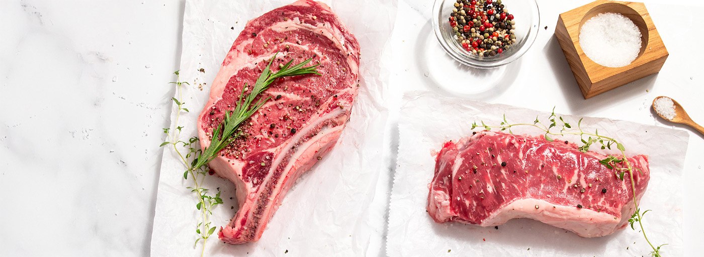 view of delicious steaks on white background