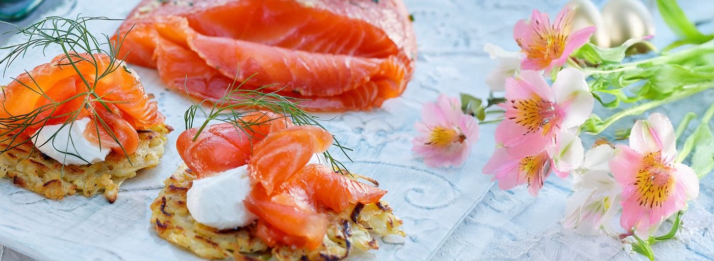 view of smoked salmon on platter with easter flowers